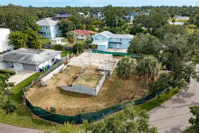 an aerial view of a house with a lake view