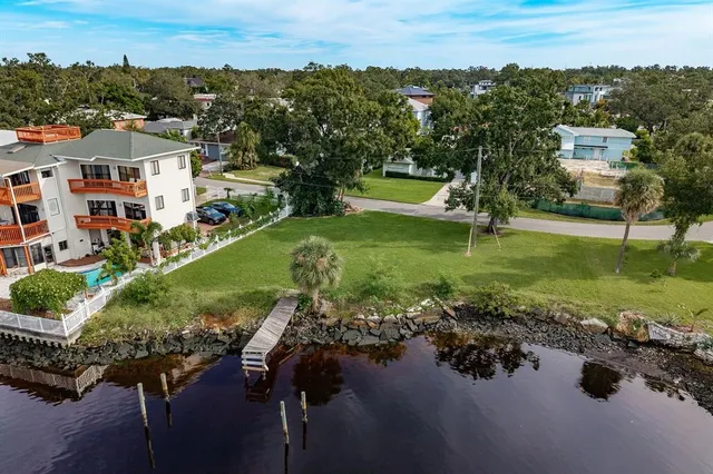 an aerial view of a house with a lake view