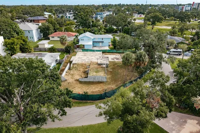an aerial view of a house with a lake view