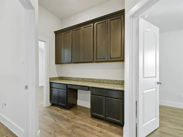 a kitchen with stainless steel appliances granite countertop a stove and a microwave