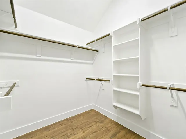 a view of an empty walk in closet