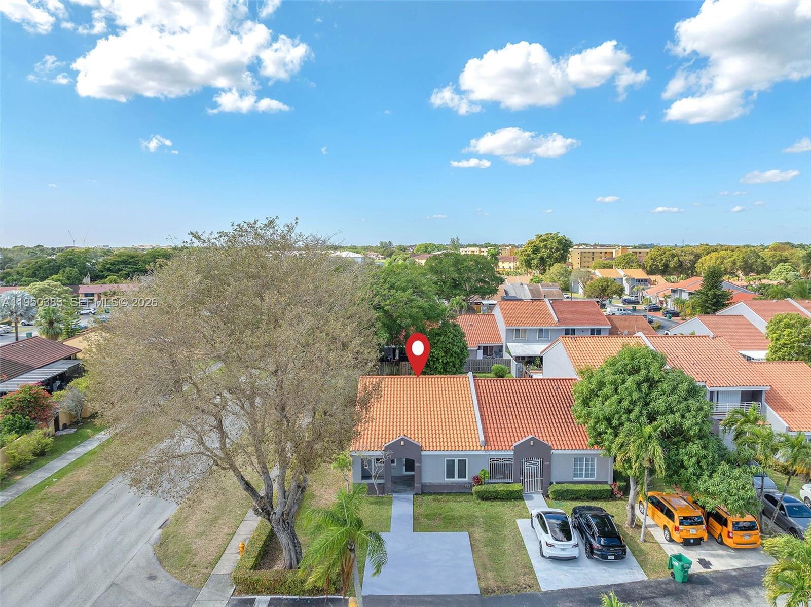 8394 Southwest 148th Avenue, Unit 8394 Miami, FL 33193 - Photo 14 of 15 an aerial view of a house with a swimming pool outdoor seating and yard