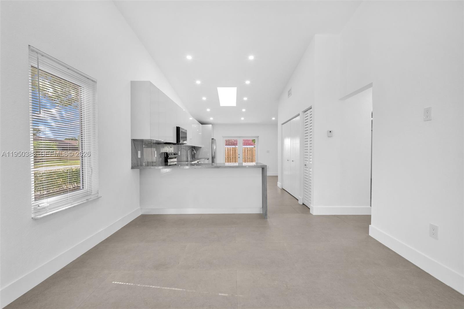 8394 Southwest 148th Avenue, Unit 8394 Miami, FL 33193 - Photo 3 of 15 a view of kitchen with stainless steel appliances cabinets