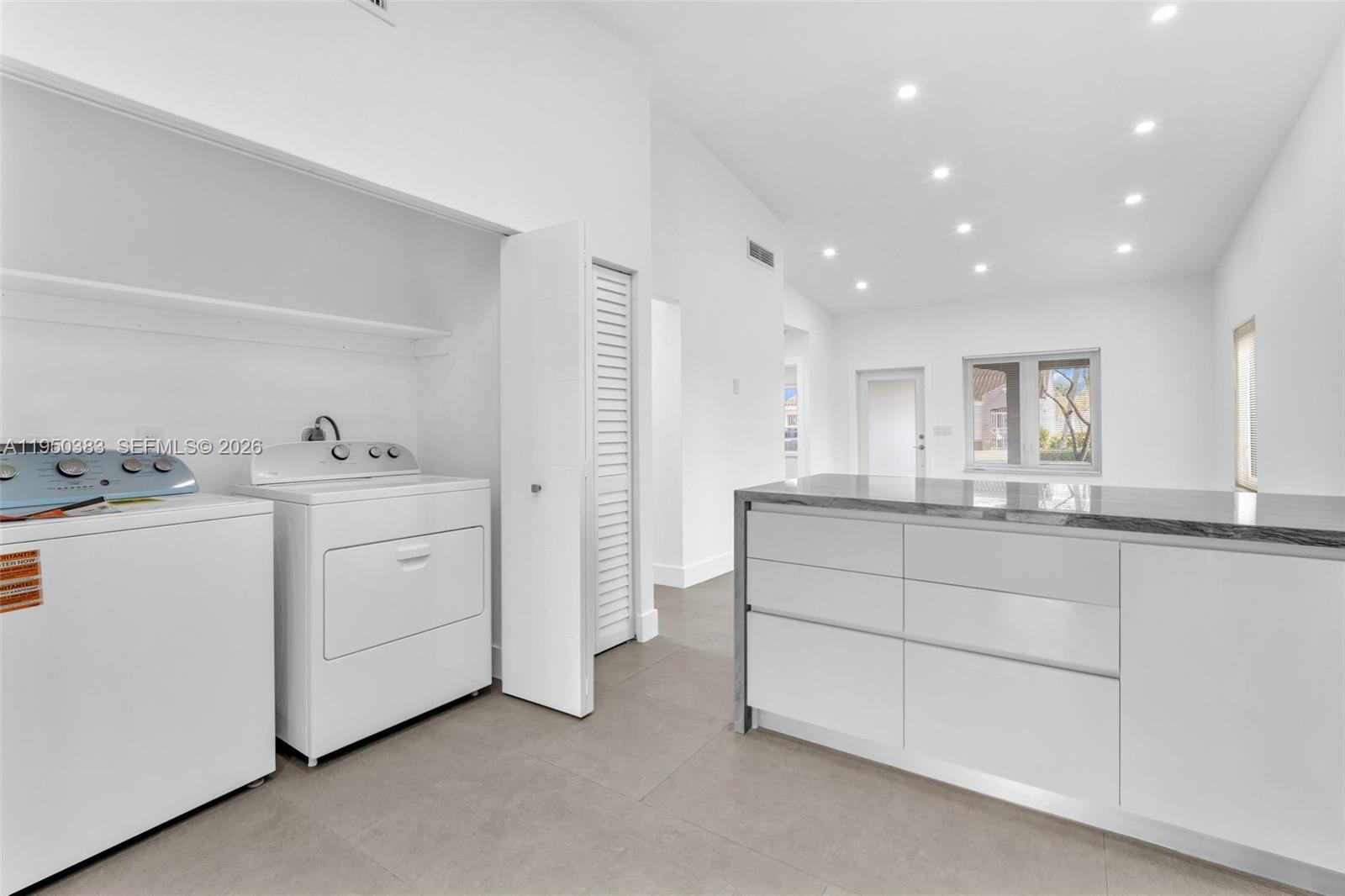 8394 Southwest 148th Avenue, Unit 8394 Miami, FL 33193 - Photo 6 of 15 a bathroom with a sink double vanity and a tub