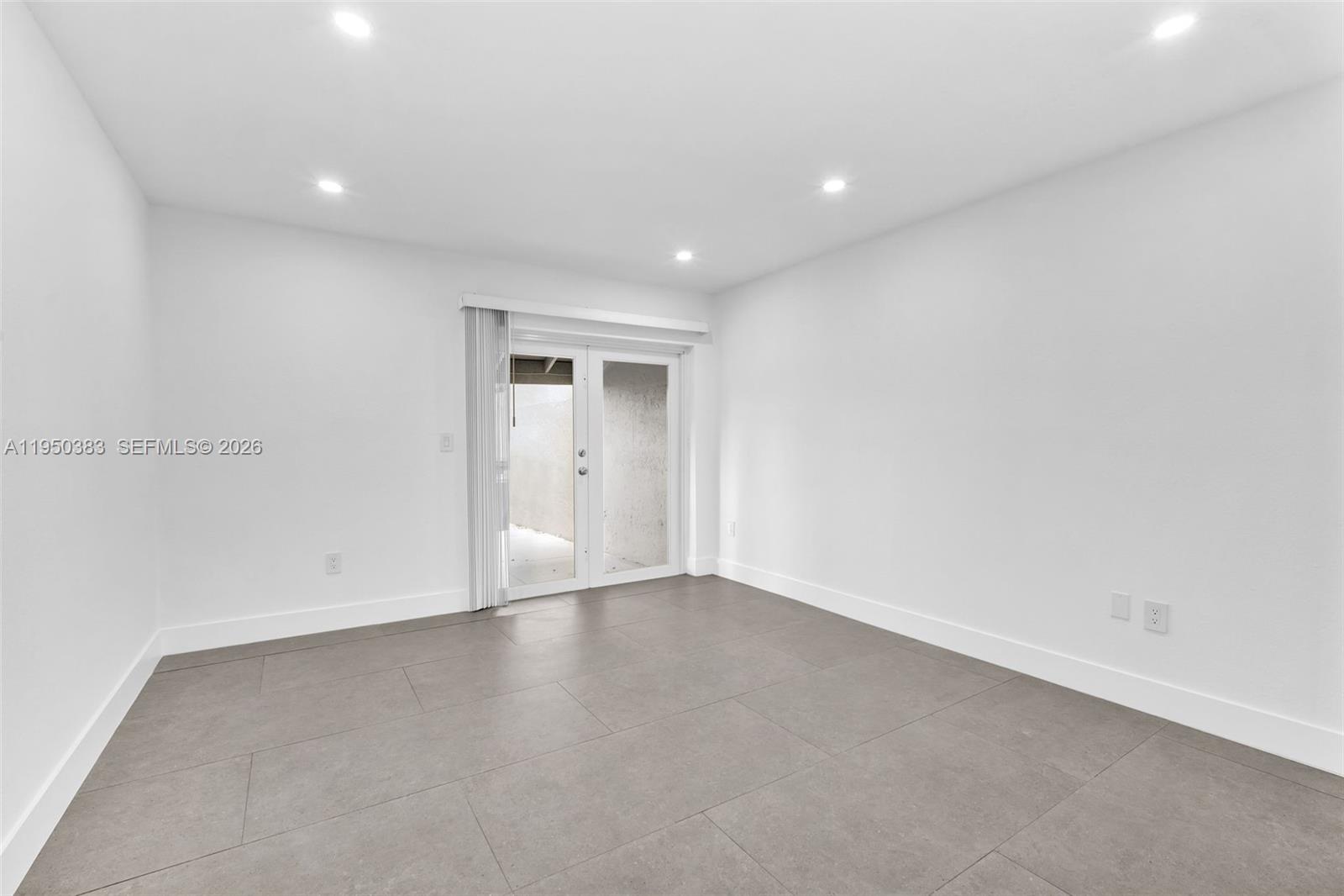 8394 Southwest 148th Avenue, Unit 8394 Miami, FL 33193 - Photo 7 of 15 a view of an empty room