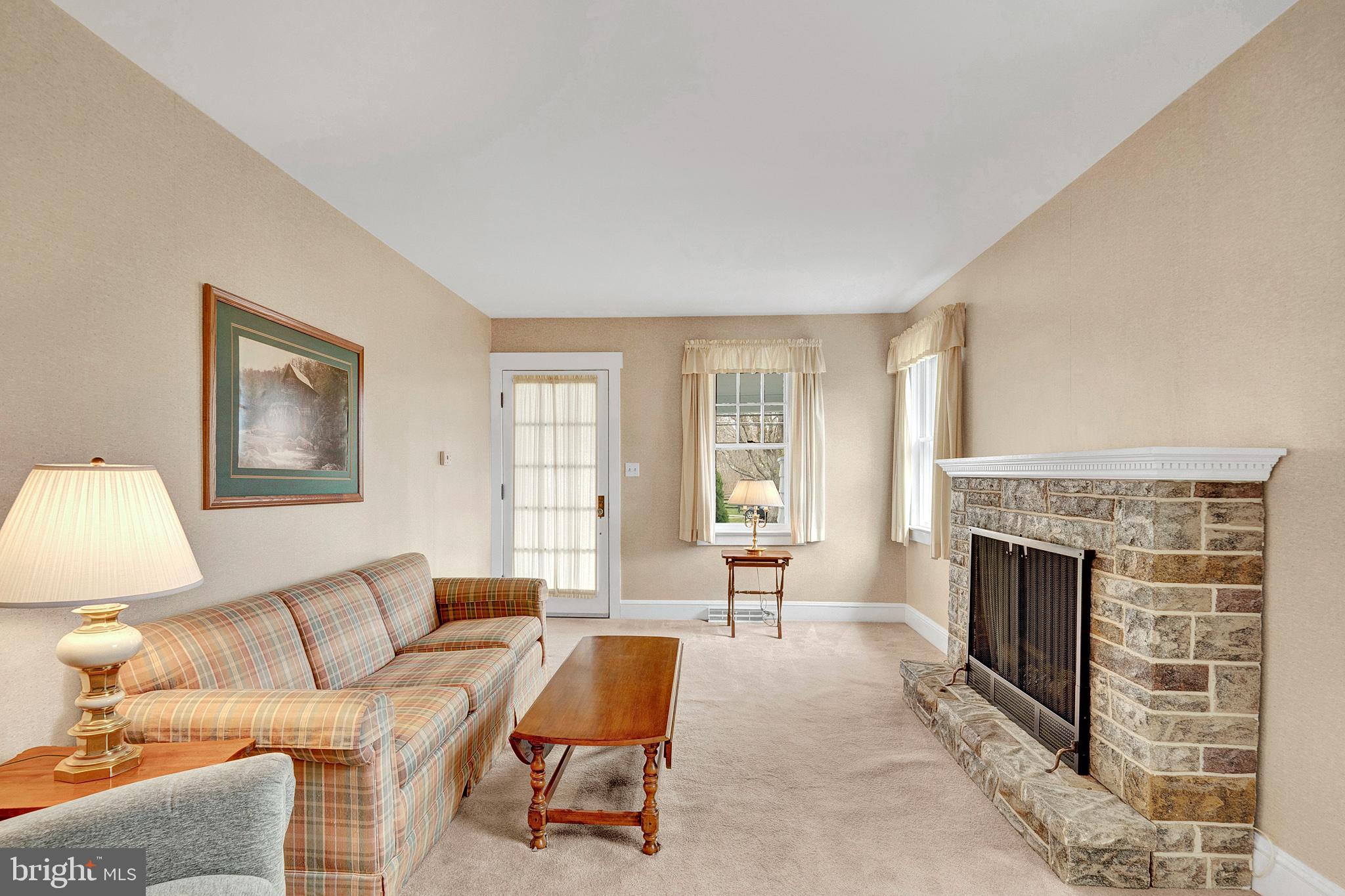 7 Diverty Road Pennington, NJ 08534 - Photo 11 of 45 a living room with furniture and a fireplace