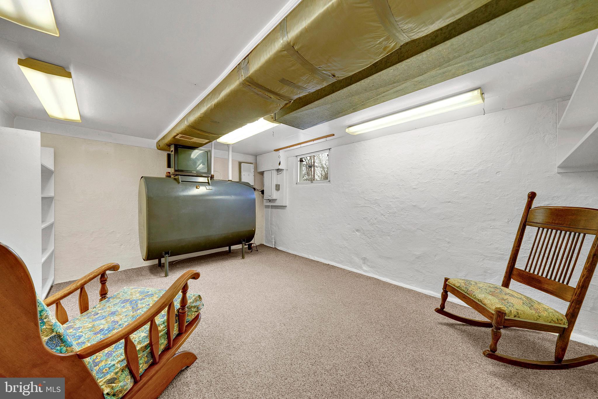 7 Diverty Road Pennington, NJ 08534 - Photo 36 of 45 a living room with furniture and a flat screen tv