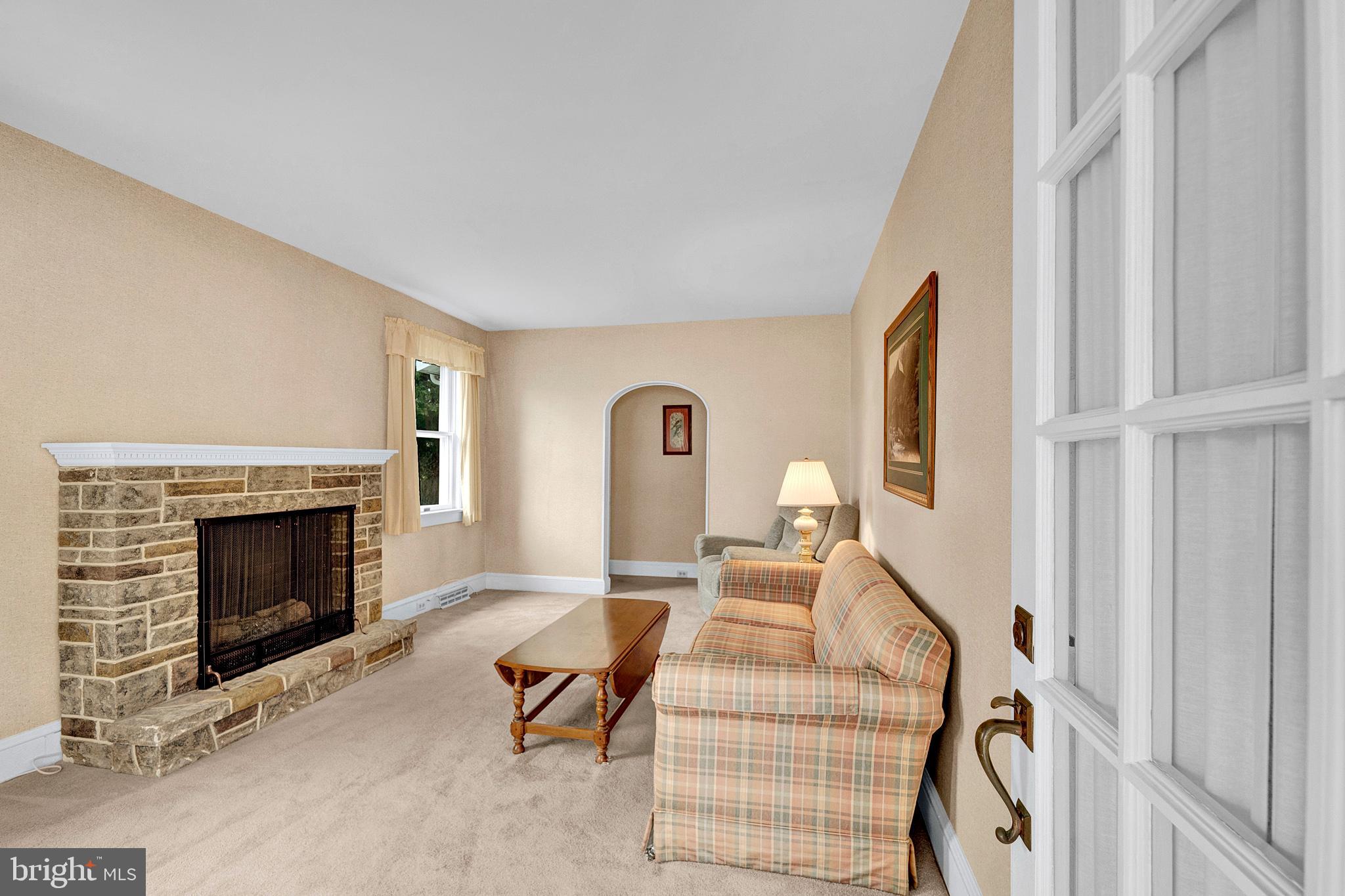 7 Diverty Road Pennington, NJ 08534 - Photo 7 of 45 a living room with furniture a fireplace and a flat screen tv