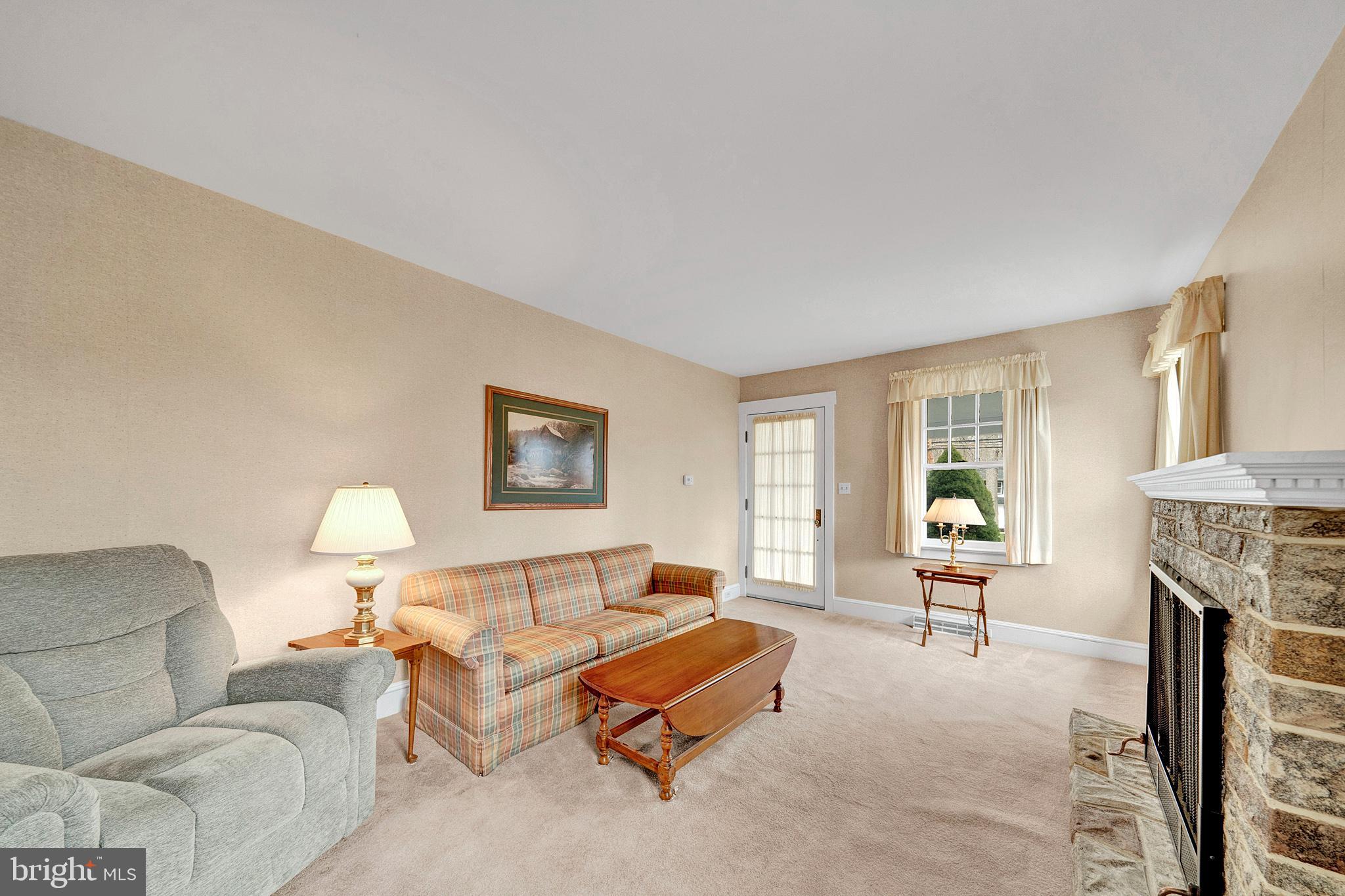 7 Diverty Road Pennington, NJ 08534 - Photo 10 of 45 a living room with furniture and a fireplace