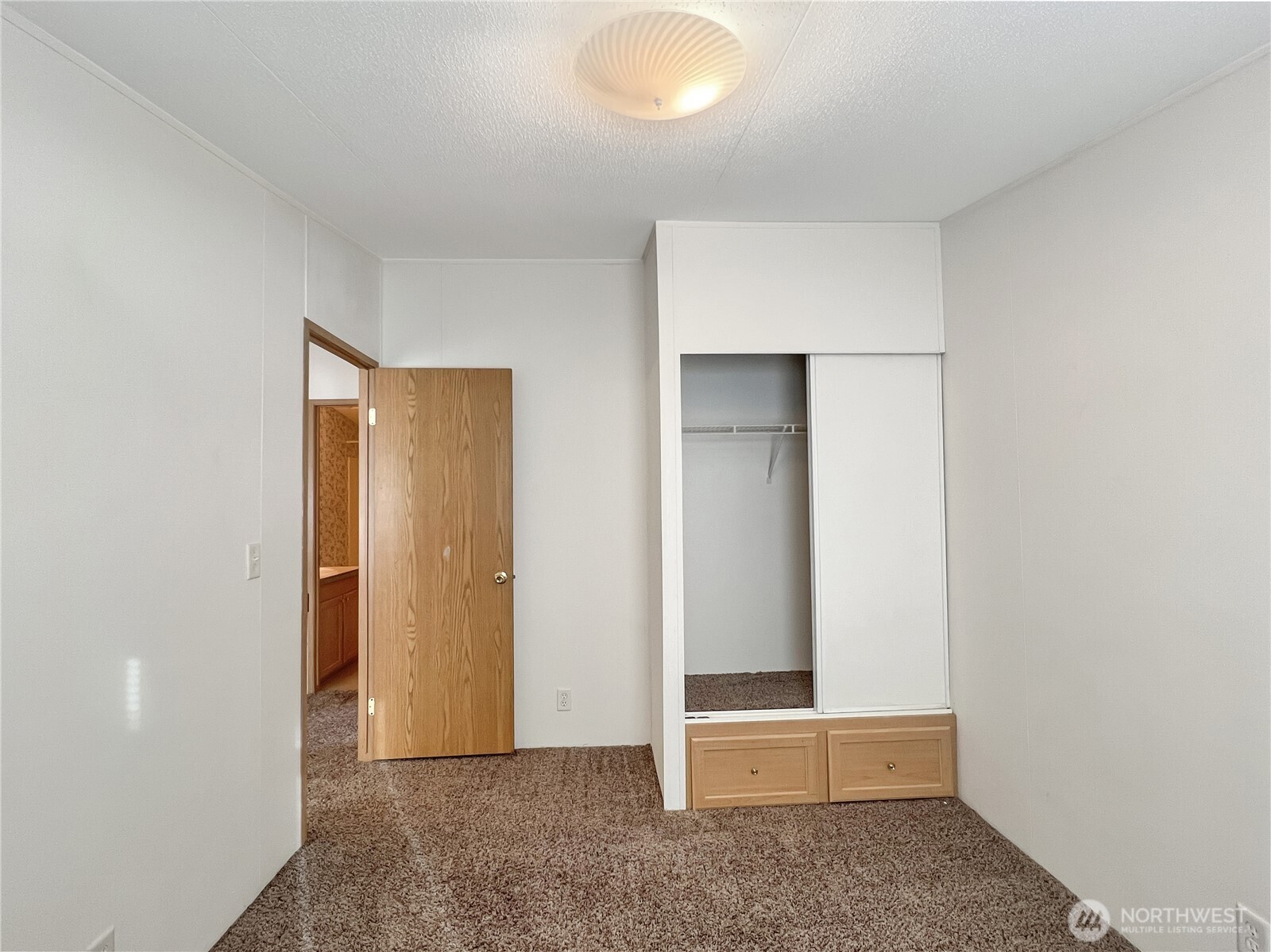 10900 Kuhlman Road Southeast, Unit 54 Olympia, WA 98513 - Photo 11 of 15 an empty room with closet
