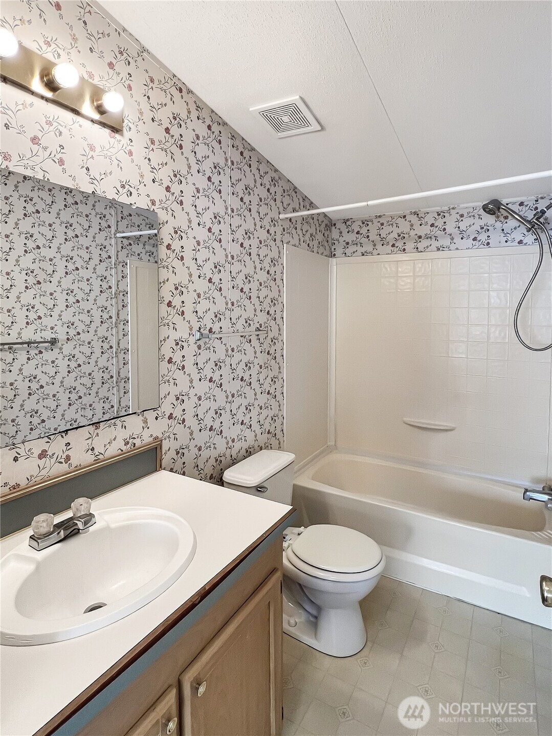 10900 Kuhlman Road Southeast, Unit 54 Olympia, WA 98513 - Photo 13 of 15 a bathroom with a sink toilet and shower