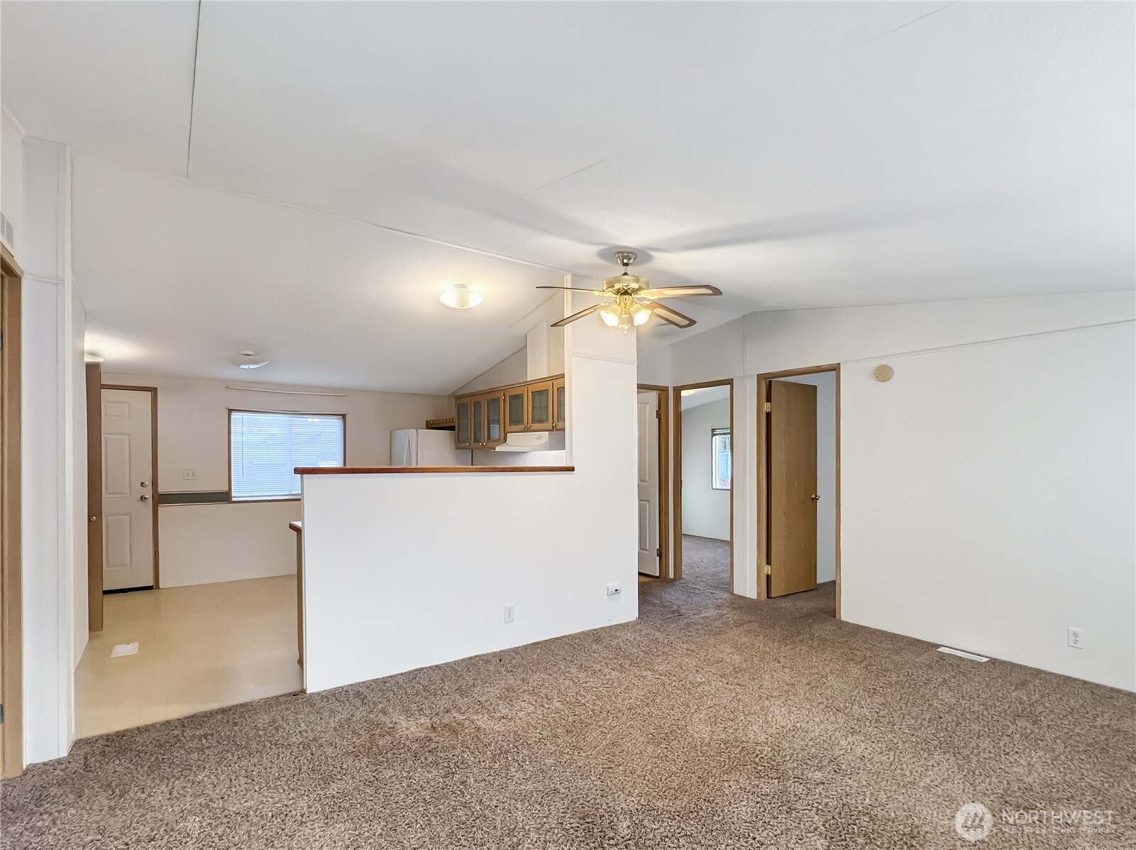 10900 Kuhlman Road Southeast, Unit 54 Olympia, WA 98513 - Photo 2 of 15 a view of a kitchen with a sink and cabinet area