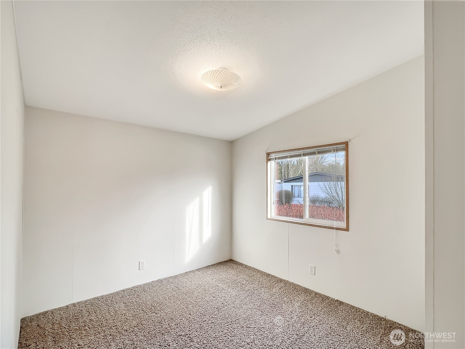 10900 Kuhlman Road Southeast, Unit 54 Olympia, WA 98513 - Photo 10 of 15 an empty room with a window