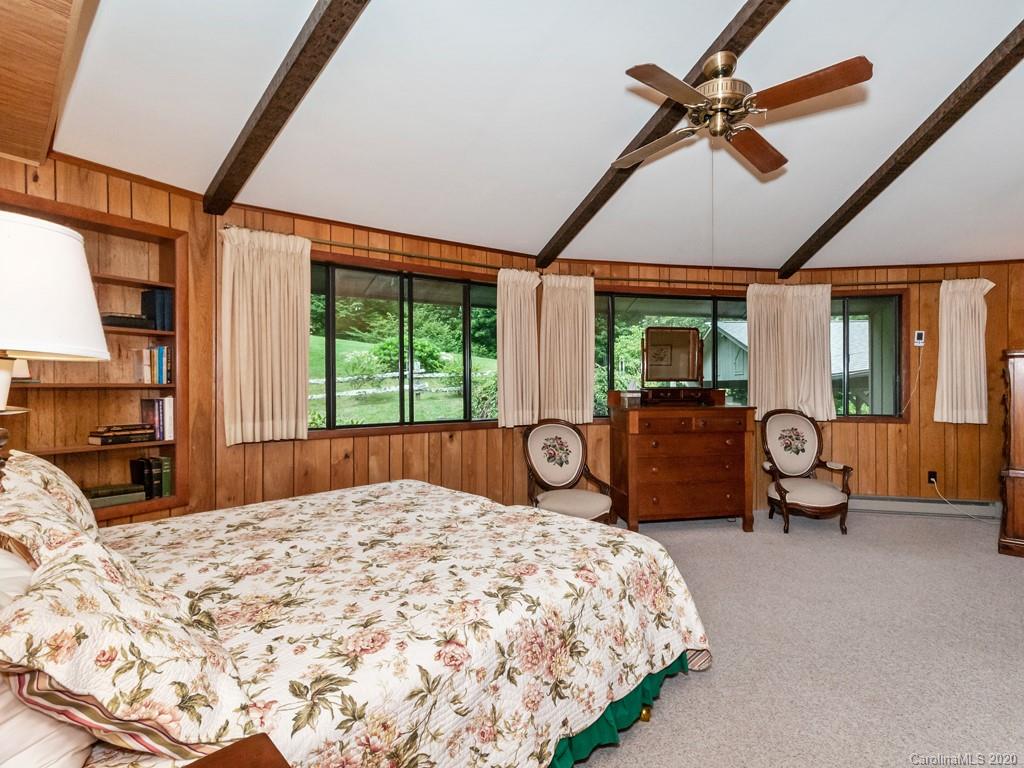 1263 Up Over Road Canton, NC 28716 - Photo 15 of 48 a bed sitting in a spacious bedroom next to a window