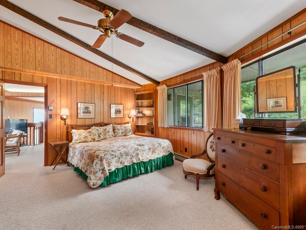 1263 Up Over Road Canton, NC 28716 - Photo 16 of 48 a spacious bedroom with a bed and large windows