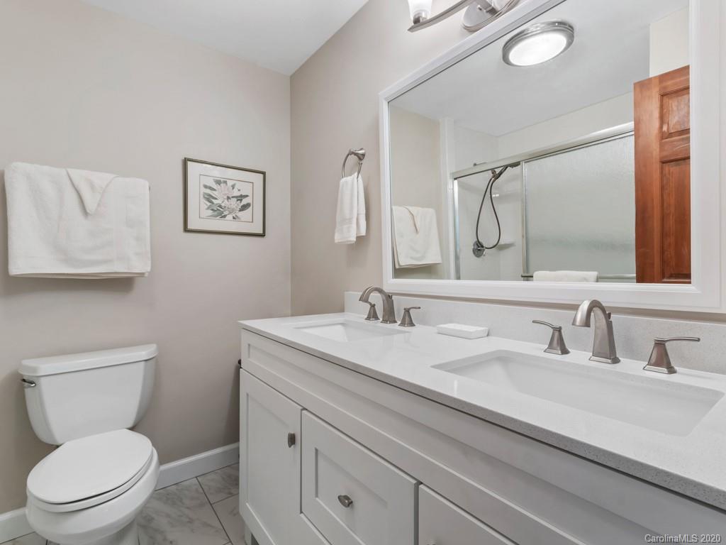1263 Up Over Road Canton, NC 28716 - Photo 17 of 48 a bathroom with a toilet sink and mirror