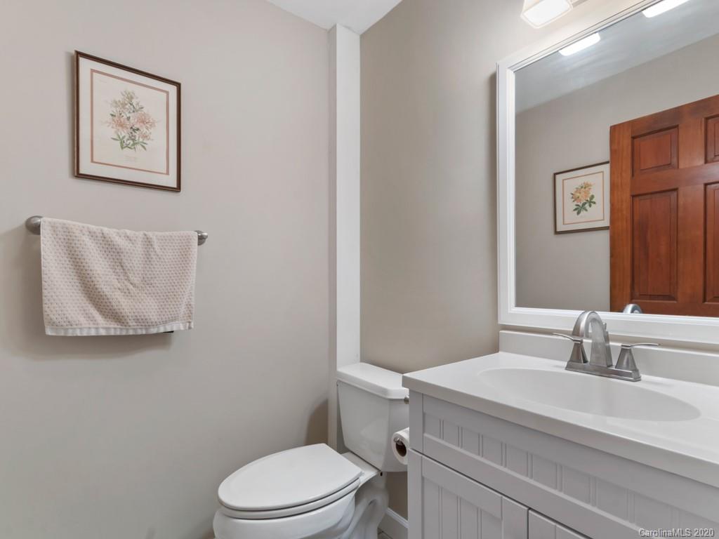 1263 Up Over Road Canton, NC 28716 - Photo 20 of 48 a bathroom with a sink mirror vanity and toilet