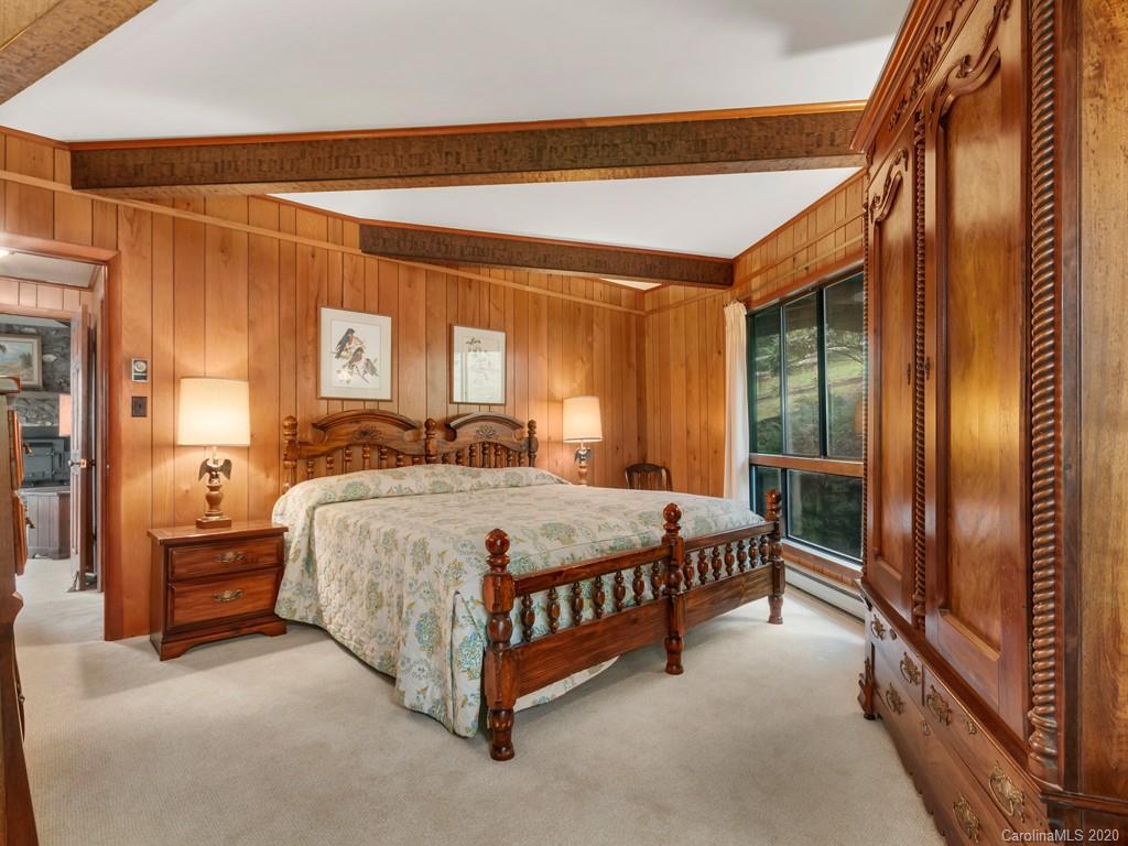 1263 Up Over Road Canton, NC 28716 - Photo 26 of 48 a spacious bedroom with a bed couch and a window