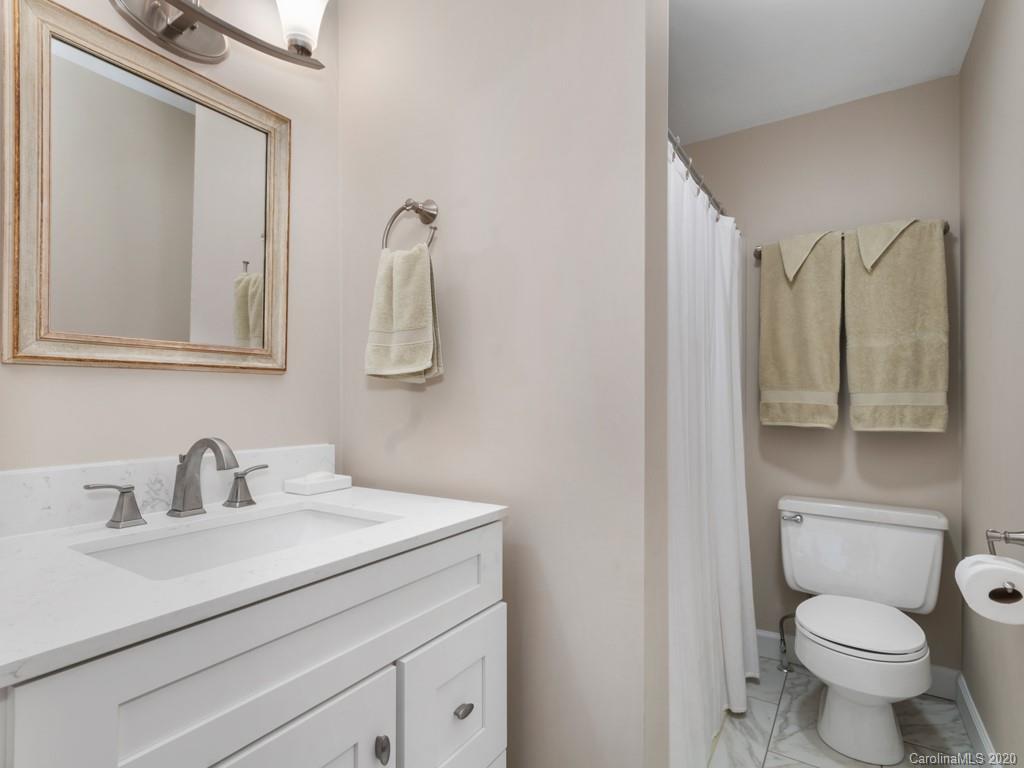 1263 Up Over Road Canton, NC 28716 - Photo 27 of 48 a bathroom with a toilet sink and mirror