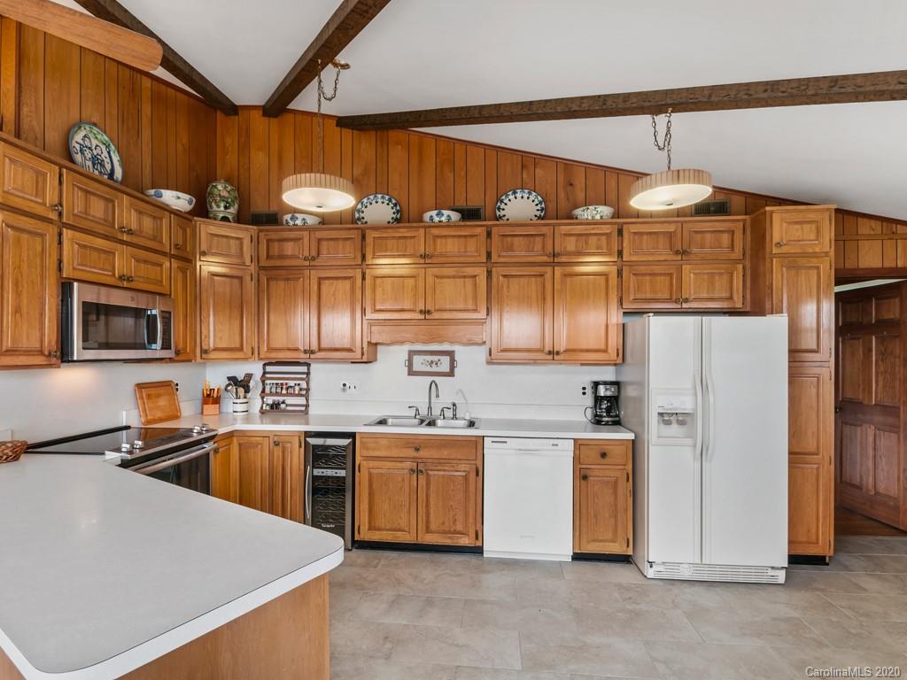 1263 Up Over Road Canton, NC 28716 - Photo 10 of 48 a kitchen that has a lot of cabinets and refrigerator