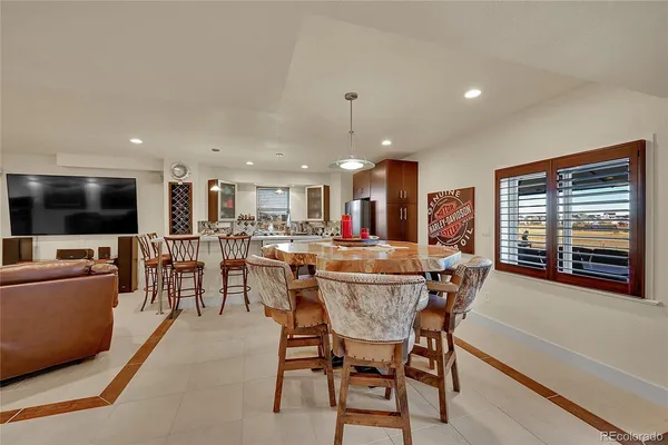 a view of a dining room with furniture window and outside view