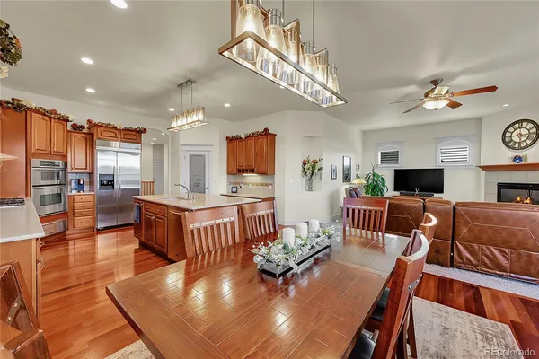 a kitchen with stainless steel appliances a sink stove and cabinets