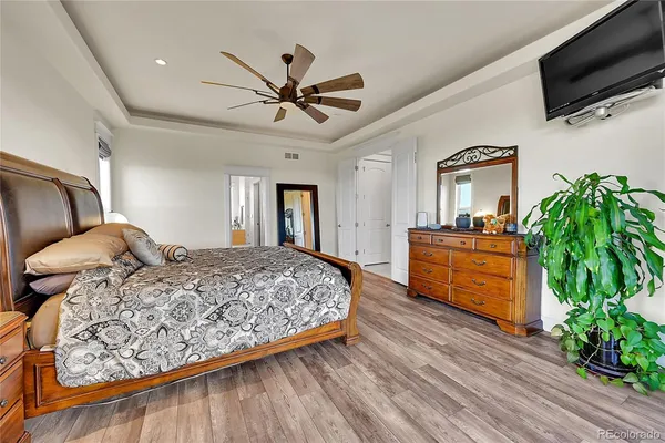 a large spacious bathroom with a granite countertop tub a sink and a large mirror