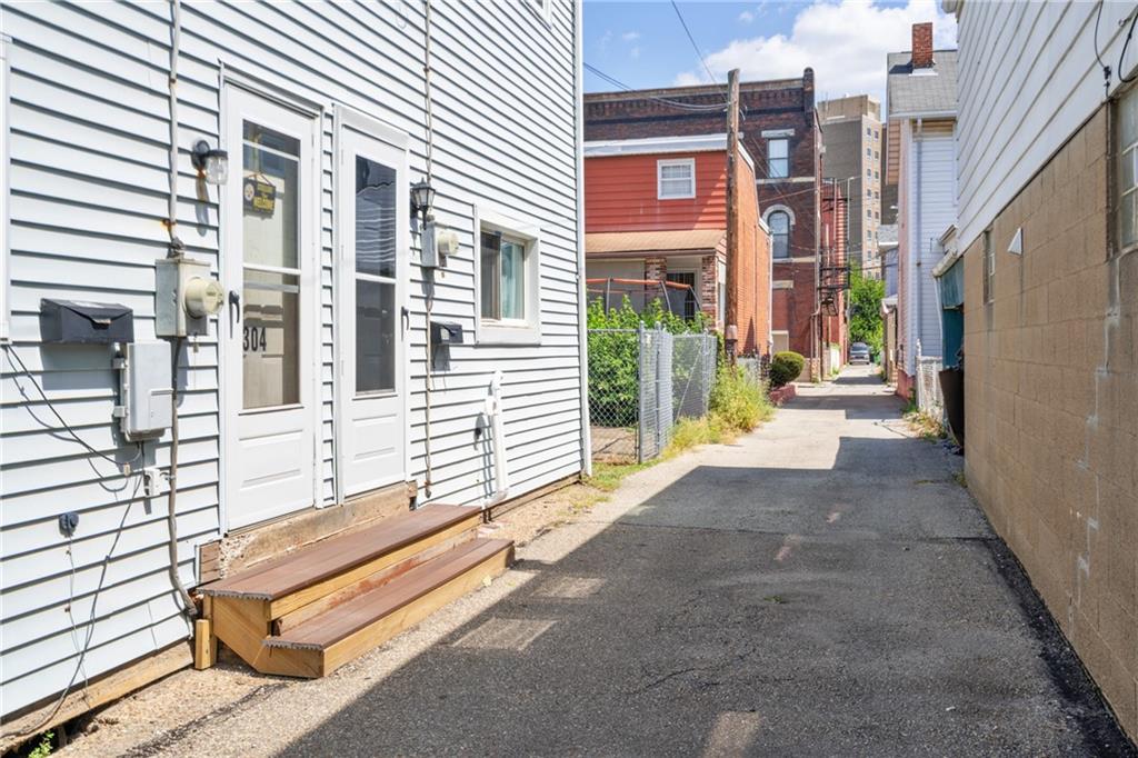 304 Pilgrim Way Pittsburgh, PA 15215 - Photo 4 of 10 a view of a building with large windows