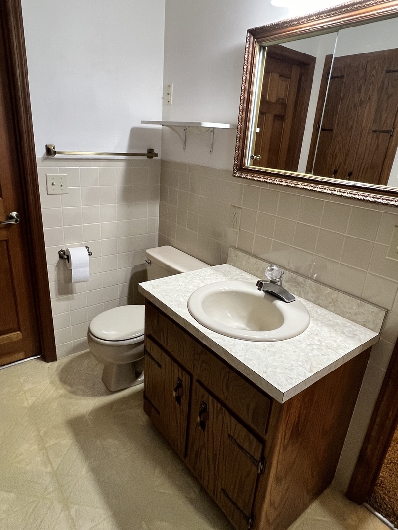 52 Sadowski Court, Unit D Decatur, IL 62521 - Photo 33 of 54 a bathroom with a sink and a toilet