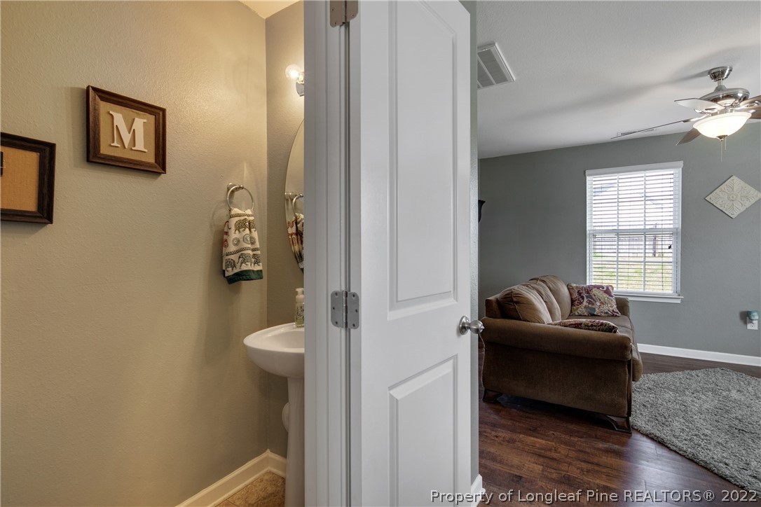 445 Botanical Court Bunnlevel, NC 28323 - Photo 12 of 38 a living room with furniture and a window