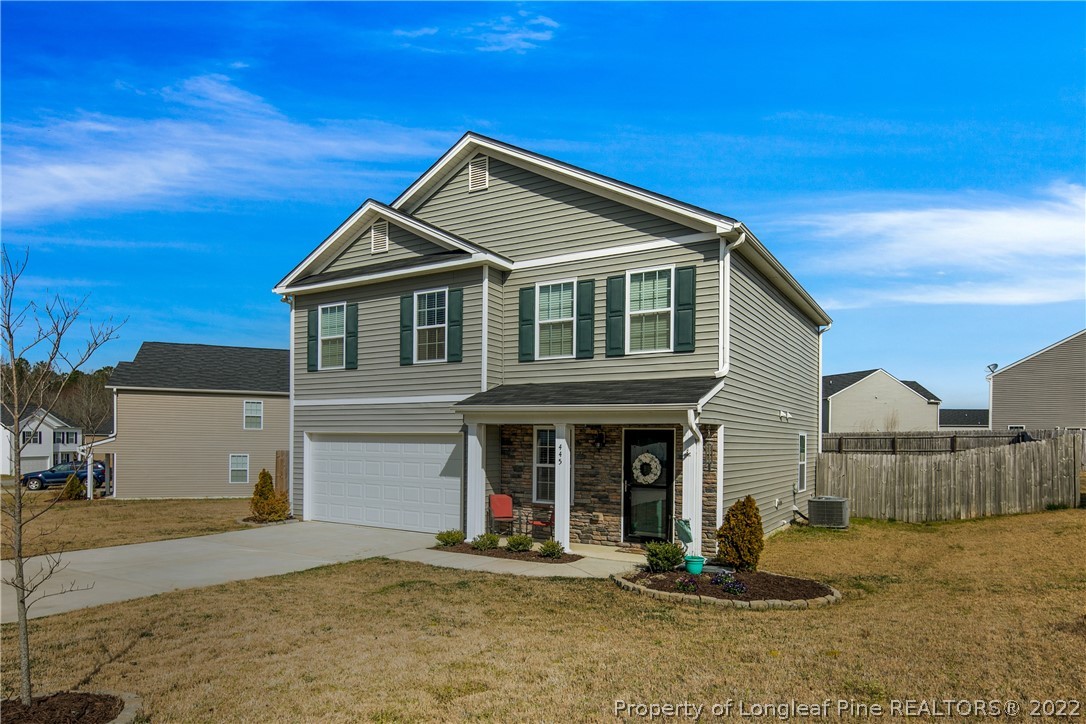 445 Botanical Court Bunnlevel, NC 28323 - Photo 2 of 38 a front view of a house with a yard