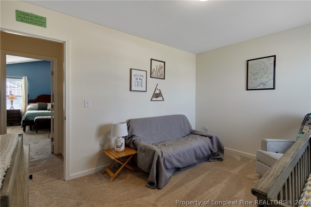 445 Botanical Court Bunnlevel, NC 28323 - Photo 27 of 38 a living room with furniture and a chair