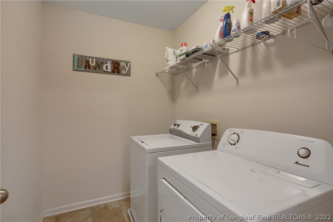 445 Botanical Court Bunnlevel, NC 28323 - Photo 29 of 38 a utility room with dryer and washer