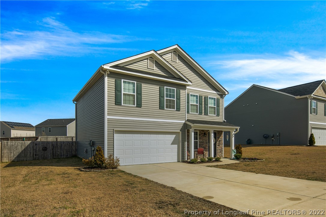 445 Botanical Court Bunnlevel, NC 28323 - Photo 3 of 38 a front view of a house with a yard