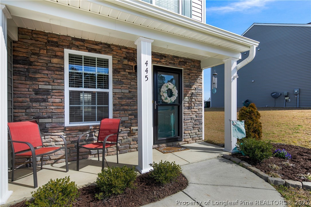 445 Botanical Court Bunnlevel, NC 28323 - Photo 4 of 38 a front view of a house with outdoor seating