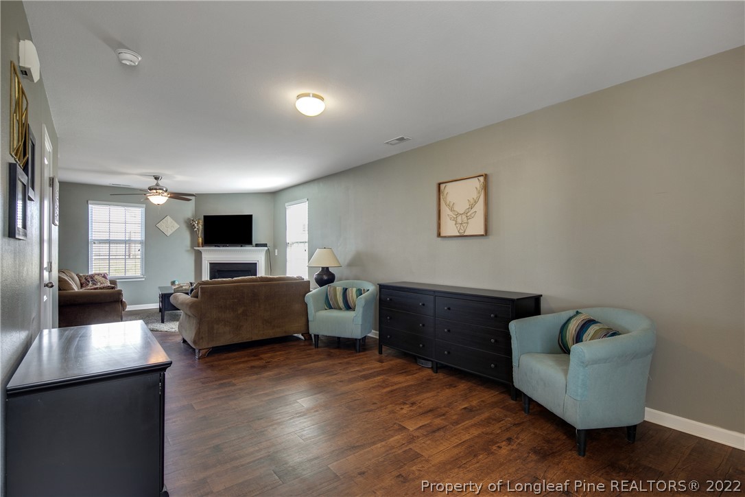 445 Botanical Court Bunnlevel, NC 28323 - Photo 6 of 38 a living room with furniture and a flat screen tv