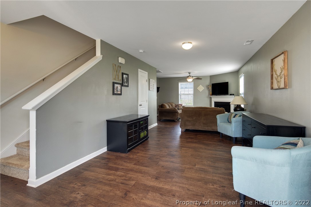 445 Botanical Court Bunnlevel, NC 28323 - Photo 7 of 38 a living room with furniture and a flat screen tv