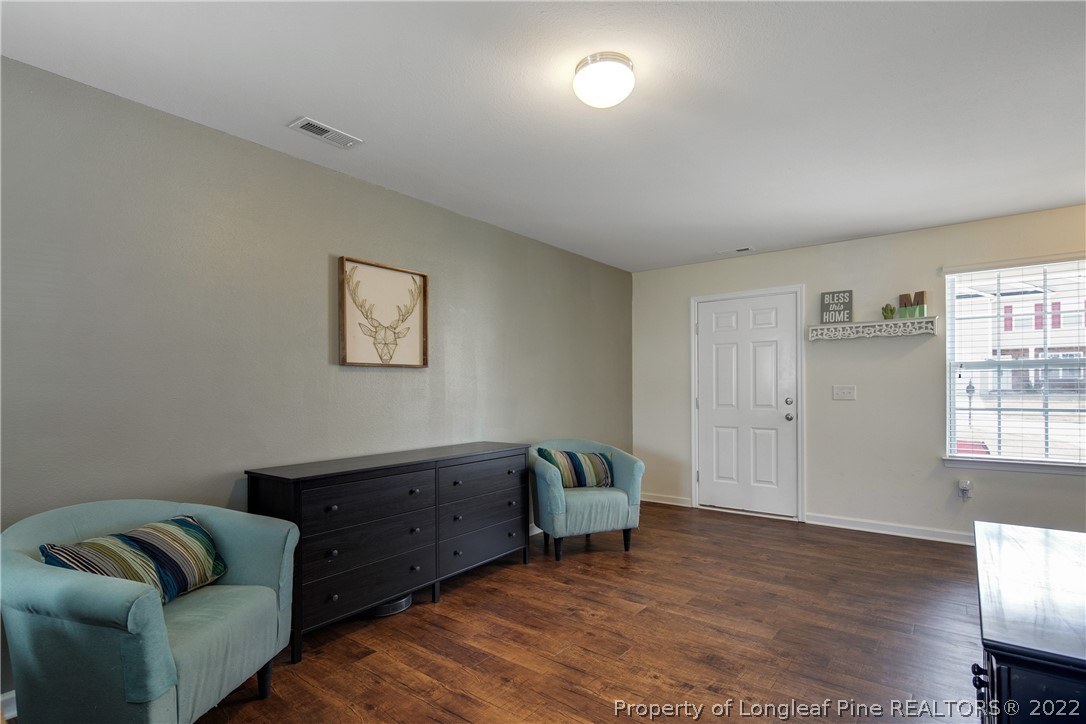 445 Botanical Court Bunnlevel, NC 28323 - Photo 8 of 38 a living room with furniture and a window