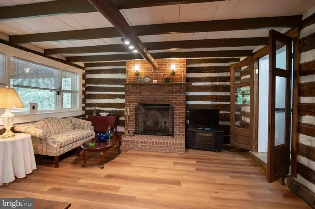 a bedroom with furniture and a fireplace