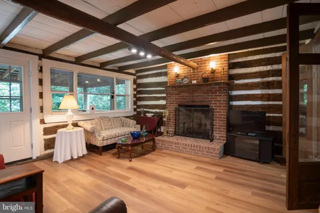 a bedroom with furniture and a fireplace
