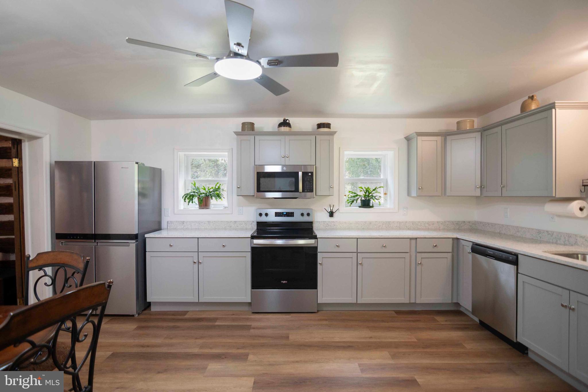 2002 Balkamore Hill Road Stanley, VA 22851 - Photo 24 of 45 a kitchen with a stove a sink and a refrigerator