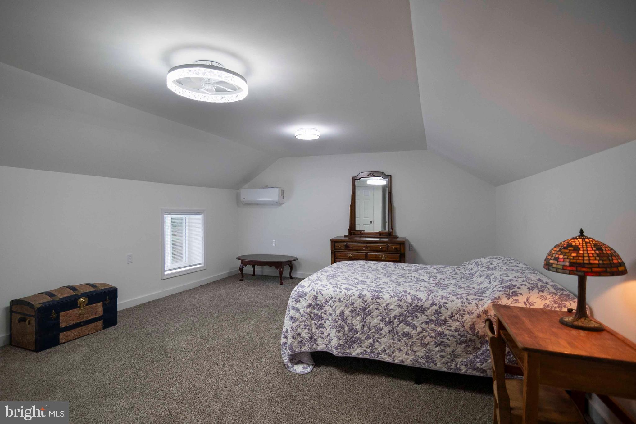 2002 Balkamore Hill Road Stanley, VA 22851 - Photo 29 of 45 a bedroom with a bed and a chair