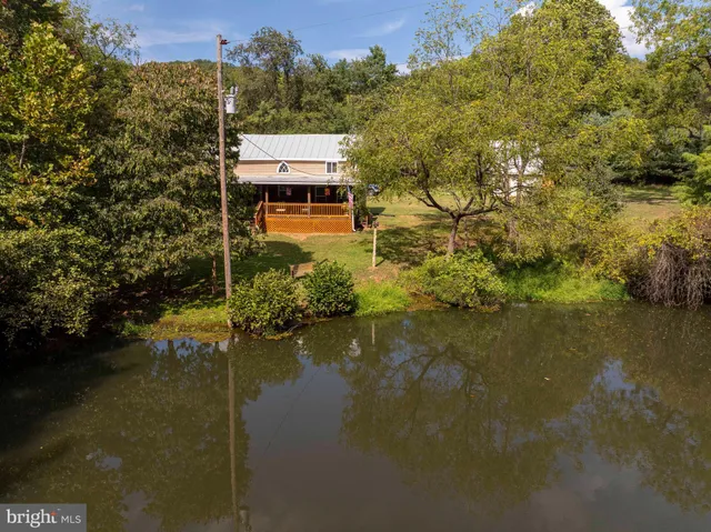 a balcony with swimming pool and lake view