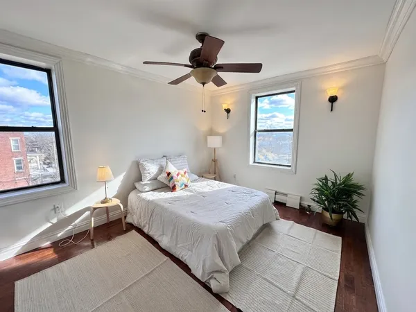 a bedroom with bed and window