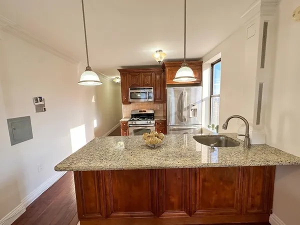 a kitchen with sink cabinets and window