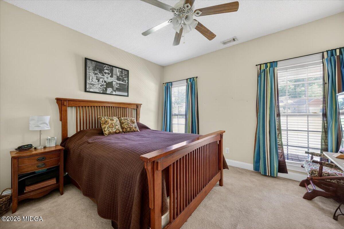619 Grayridge Road Gray, GA 31032 - Photo 19 of 40 a bedroom with a bed and a window