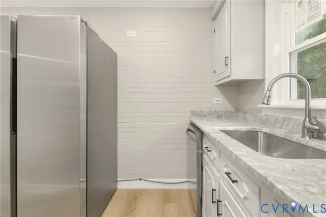 a kitchen with a sink and cabinets