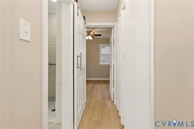 a view of a bathroom from a hallway