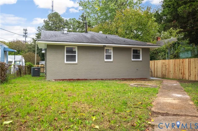 a view of a house with a yard and a garage