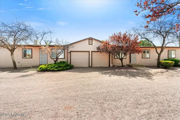 front view of a house with a road